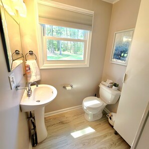 Combined shower/bathtub, towels, soap, shampoo