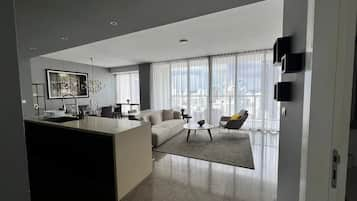 Luxury Apartment | Living area | 65-inch Smart TV with digital channels, TV