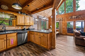Enjoy cooking in this well-equipped kitchen with a large island, sink, and ample countertop space.
