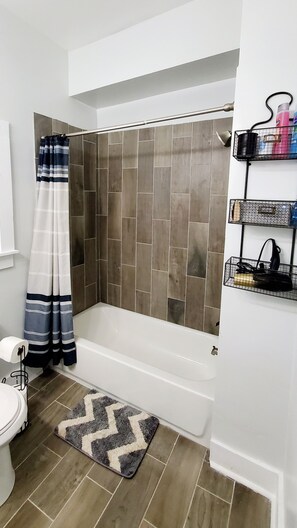 Combined shower/bathtub, hair dryer, towels, soap - Experience Indianapolis living closer to Lucas Oil Stadium (Indianapolis)