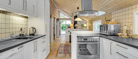 Fridge, stovetop, dishwasher, coffee/tea maker