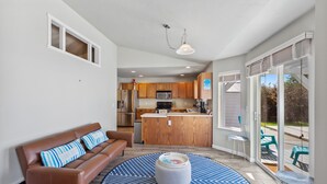 A modern kitchen with wooden cabinets, a stainless steel refrigerator, and a built-in microwave. - *PRIVATE LEISURE POOL* 3bd 2ba Home Near Bypass&Amenities (Kalispell)