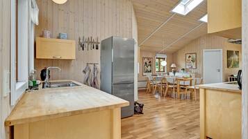 Fridge, stovetop, dishwasher, coffee/tea maker