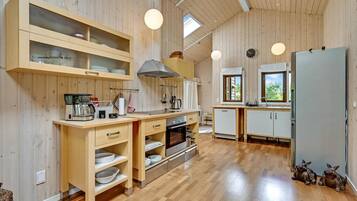 Fridge, stovetop, dishwasher, coffee/tea maker