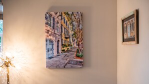 A framed painting of a street scene on a wall. - 2 Charleston's Charm Studio 2 is a Private studio 4 miles to Downtown Charleston (Charleston)