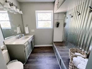 Combined shower/tub, hair dryer, towels, soap