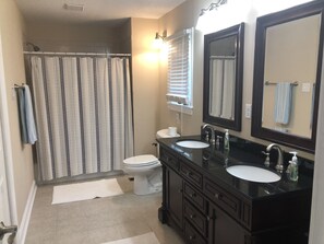 Combined shower/bathtub, hair dryer, towels, soap