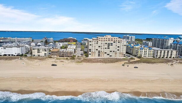 A coastal cityscape with a beach, buildings, and a clear sky. - Hidden Gem Oceanview! 3BD/2BR, Steps to the beach! (Ocean City)