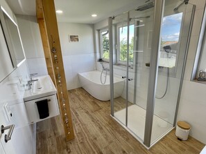 Bathtub, hair dryer, towels, soap