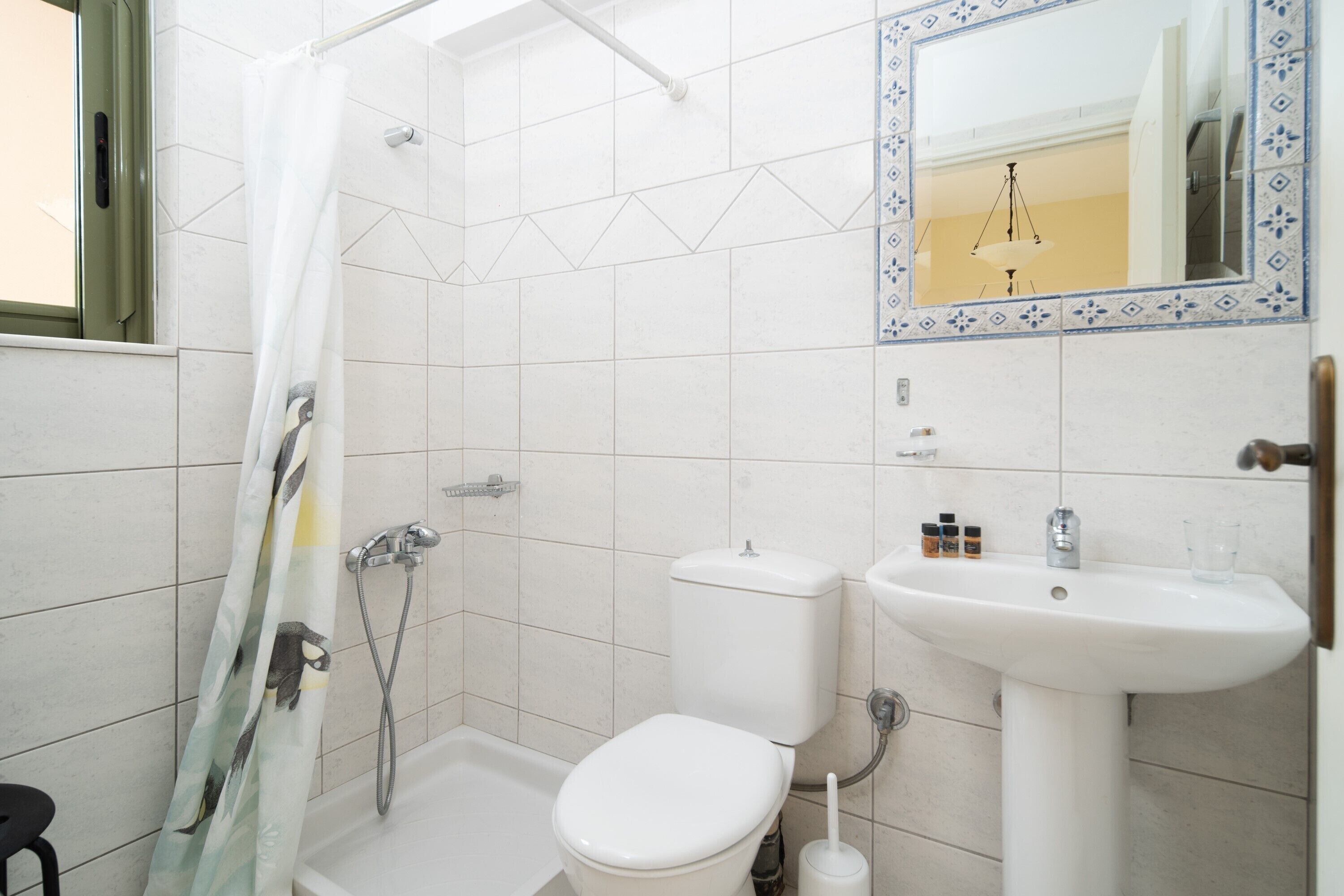 Shower, rainfall showerhead, hair dryer, towels