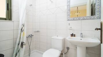 Shower, rainfall showerhead, hair dryer, towels