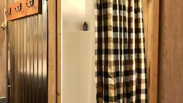 Shower, hair dryer, towels, toilet paper