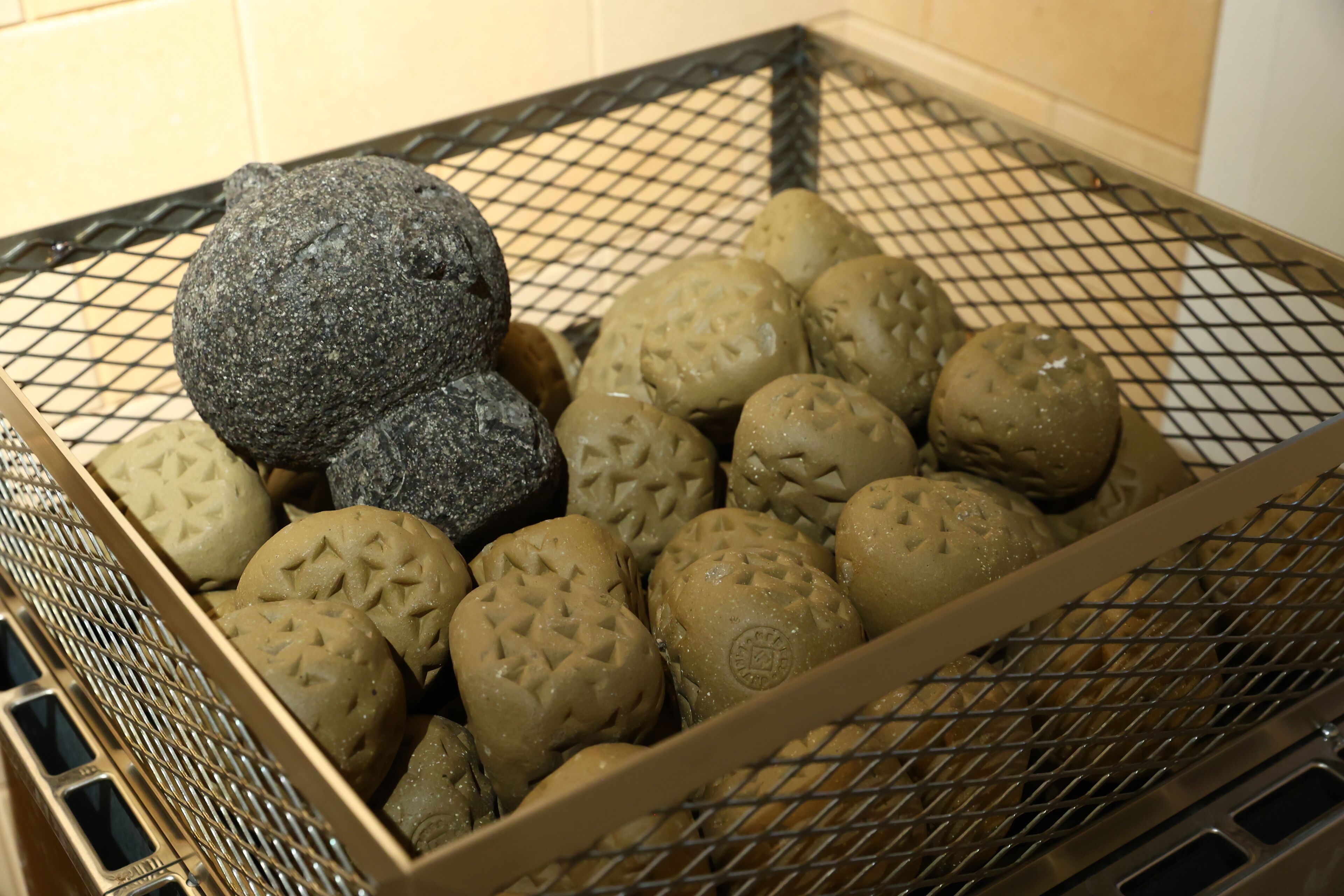 A tray of variously shaped and textured bread rolls.