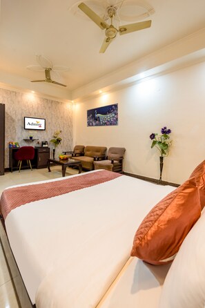 Superior Room | Living area | 40-inch LED TV with satellite channels, TV - Hotel Diamond Stay by ASPL (Noida)