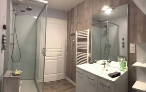 Shower, hair dryer, towels, soap