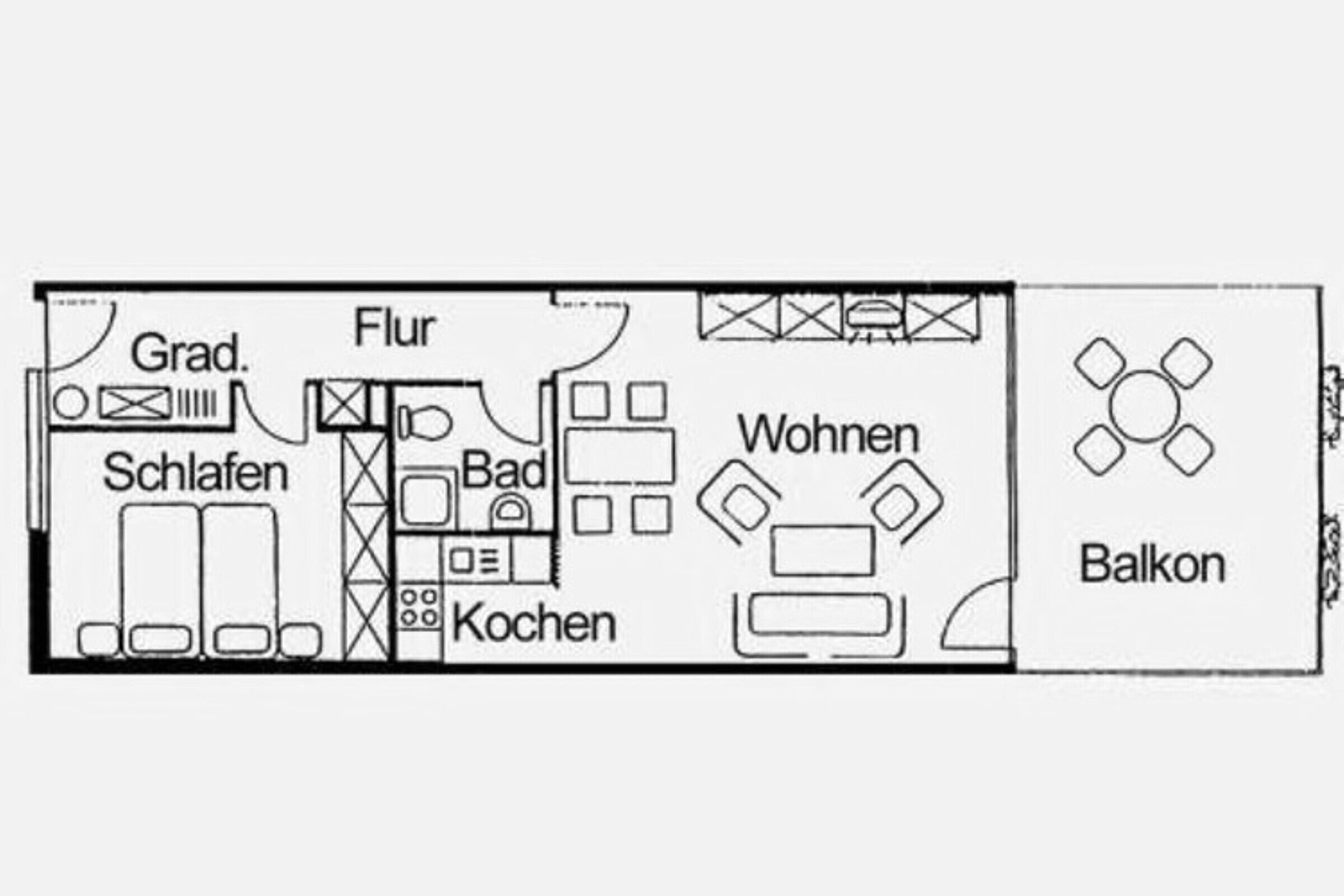 Un plan d’étage comprenant un salon, une cuisine, une salle de bain et un balcon.