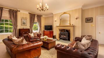 Luxury House | Living area | 42-inch Smart TV with satellite channels, TV, fireplace