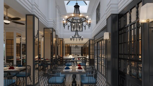 A spacious dining area with a high ceiling, ornate chandeliers, and a patterned floor. - Hotel DMelin (Ho Chi Minh City)