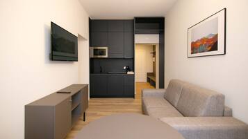 Deluxe Condo | Living area | 43-inch Smart TV with digital channels, TV
