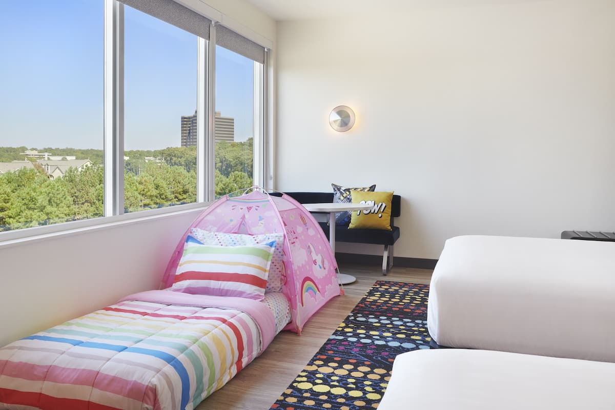 Premium bedding, down comforters, pillowtop beds, laptop workspace