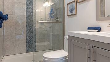 Shower, hair dryer, towels, toilet paper