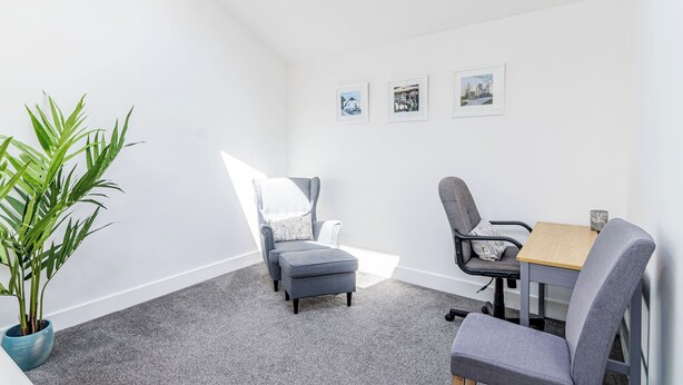 A modern meeting room with a skylight, grey carpet, and a potted plant. - We love how modern and stylish High Trees View is. (Knaresborough, near Harrogate)