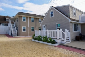 Stunning two-story residence with a charming front deck and inviting porch area.