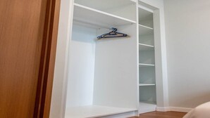A walk-in closet with multiple shelves and a hanging rod. - MONTLY OFFER 3BR 3 Min Walk KLCC FREE WIFI 6 PAX (Kuala Lumpur)