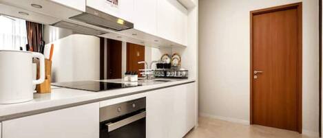 Fridge, microwave, cookware/dishes/utensils