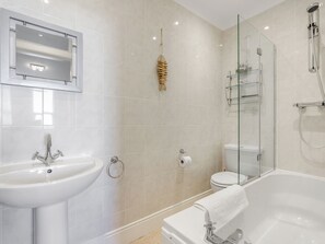 A modern bathroom with a sink, toilet, and bathtub. - Immaculate Sea View Apartment - Desirable West Cliff Location. (Whitby)