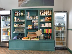 A grocery display with various food items and beverages.