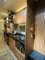 Deluxe Studio Suite, Sea View | Living area | 40-inch Smart TV with satellite channels, TV, Netflix