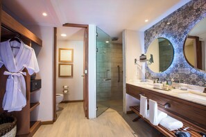 Shower, designer toiletries, hair dryer, slippers