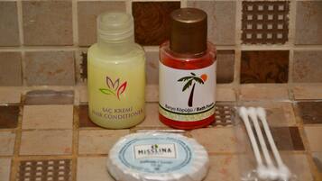 Shower, hair dryer, slippers, towels