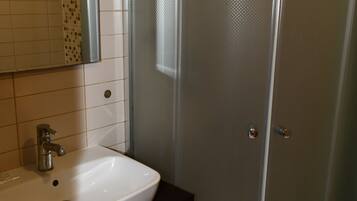 Shower, hair dryer, slippers, towels
