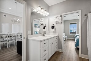 Enjoy a spacious bathroom with a double sink, walk-in closet, and city views from the balcony.