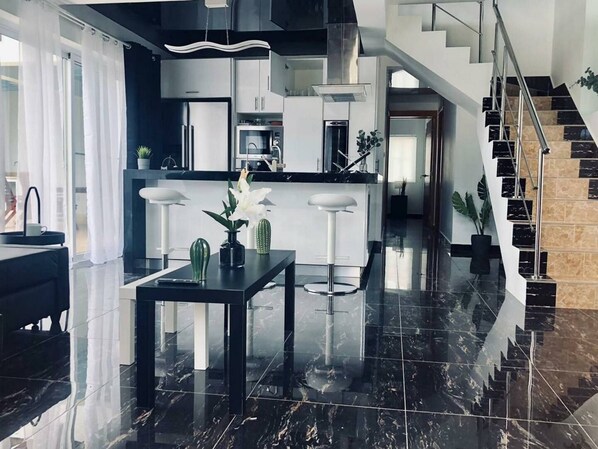 Fridge, cookware/dishes/utensils, dining tables