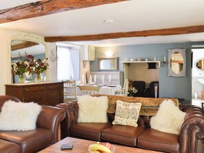 TV, fireplace - This charming cottage has a secluded garden which is perfect for relaxing in. (Ulwell, near Swanage)