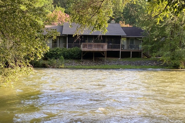 View of the cottage from across the river
