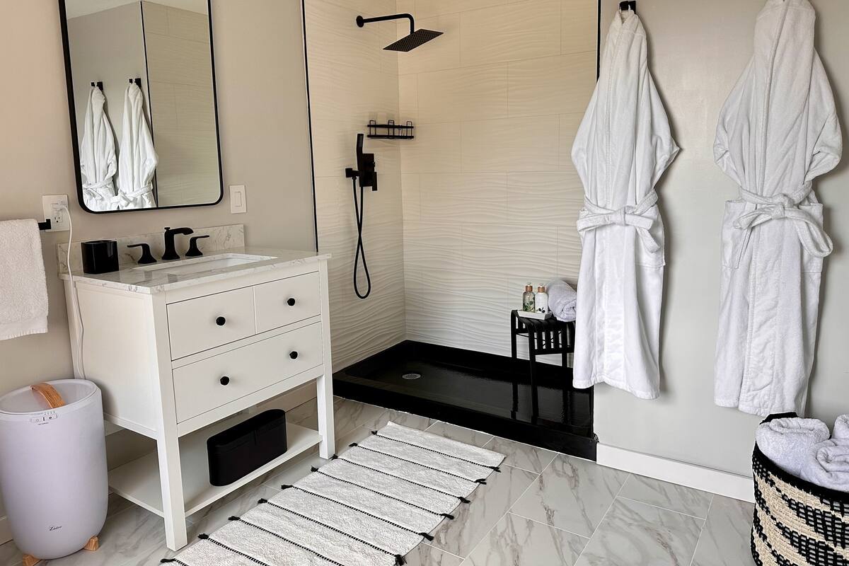 Serenity Suite | Bathroom | Shower, rainfall showerhead, designer toiletries, hair dryer