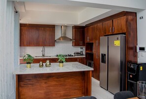 Fridge, cookware/dishes/utensils, dining tables