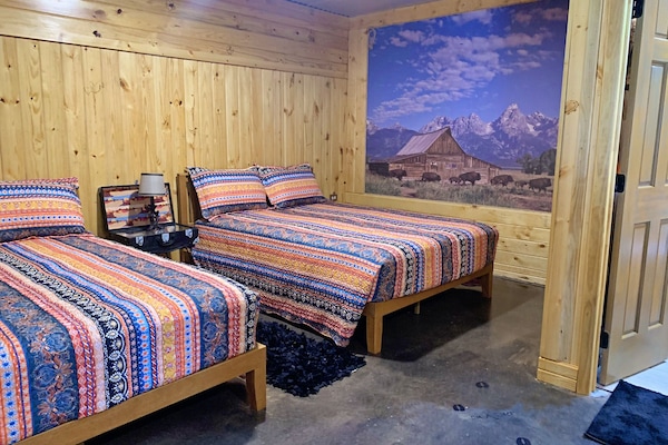 comfy queen sized beds in the Seek and Snore Cabin at The Lazy Buffalo, Cache OK