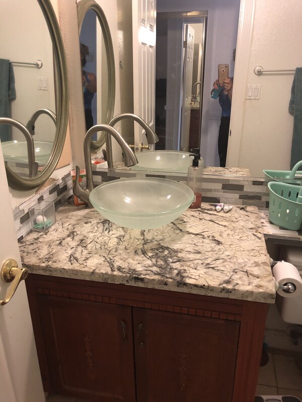 Combined shower/bathtub, towels, soap, toilet paper