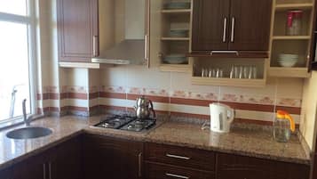 Apartment | Private kitchen | Fridge, stovetop, dishwasher, cookware/dishes/utensils