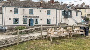 A white building with a sign reading "The Ship Inn." - 1 bedroom accommodation in Mevagissey (Mevagissey)