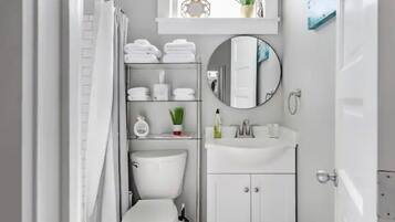 Combined shower/tub, hair dryer, towels, soap