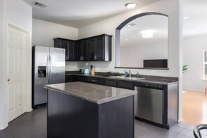 Fridge, microwave, oven, stovetop - Modern South Austin Home|King Bed • Gym • Patio • Sleeps 6- Ideal for long stays (Austin)
