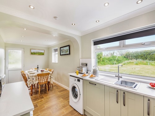 Attached cottage tucked down a pretty lane only a short drive from Pwllheli.