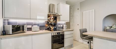 Fridge, microwave, oven, dining tables