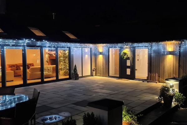 Outdoor area illuminate in the evening | Farmhouse Cottage - Colley Mill Farm, North Rode